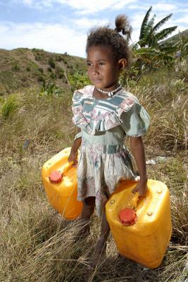 Help create a future where this young girl doesn't need to carry water. Photo: Oxfam / Jerry Galea.